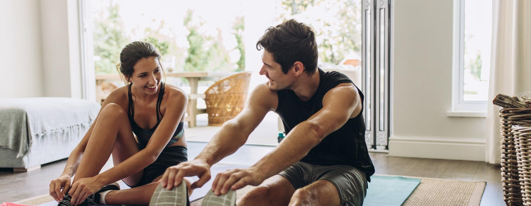 a man and woman sitting on the floor