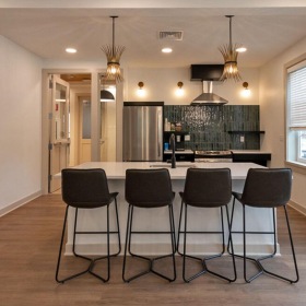 The essence of exceptional living a dining room with a table and chairs