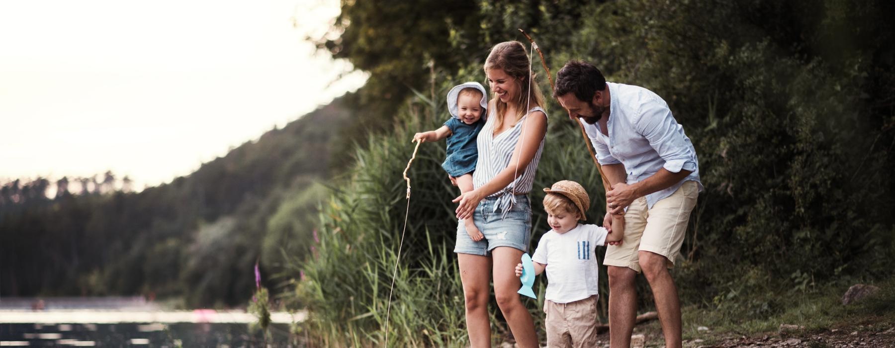 a family standing in a shallow pond