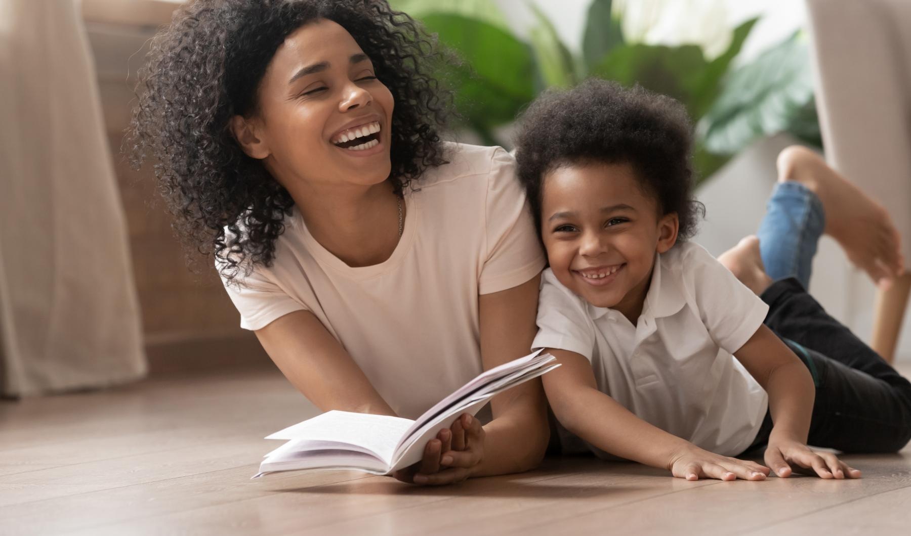 a person and a child reading a book